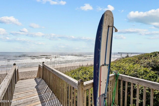 view of property's community featuring a view of the beach and a water view