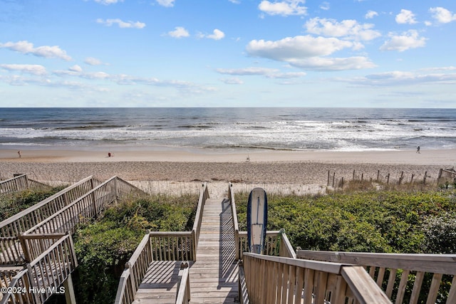 view of water feature with a beach view