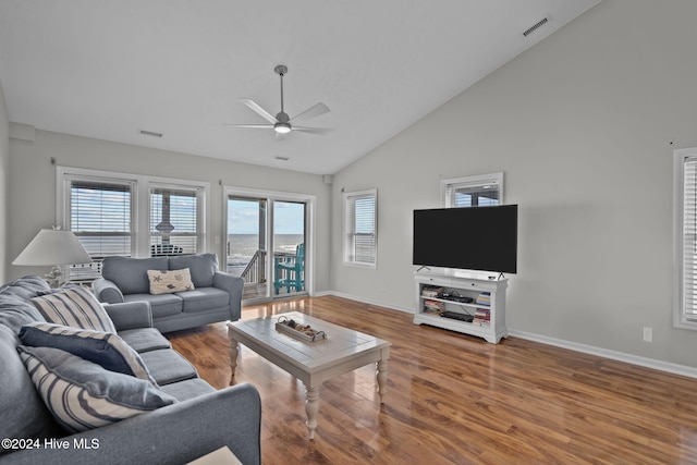 living room featuring ceiling fan, wood finished floors, visible vents, and baseboards