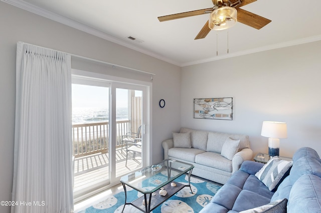 living room with ornamental molding and ceiling fan