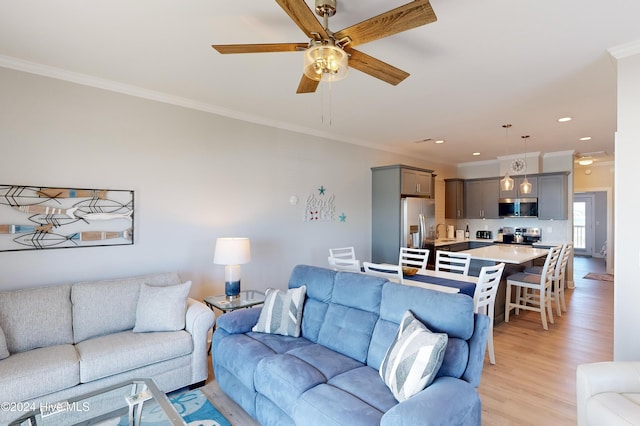 1796 New River Inlet Rd, North Topsail Beach, NC 28460 - living area featuring ornamental molding, light wood-style floors, a ceiling fan, and recessed lighting