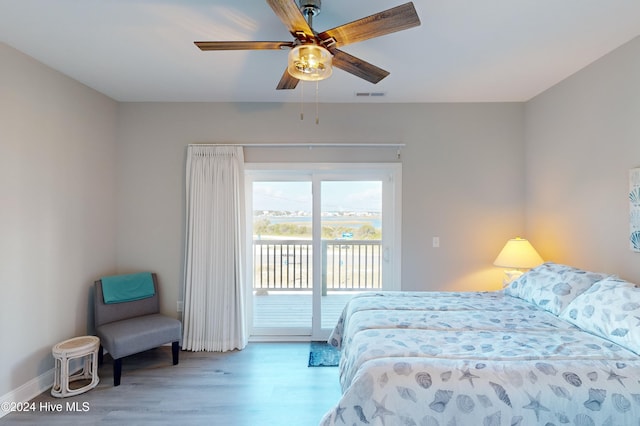 bedroom with access to outside, ceiling fan, and light wood-type flooring