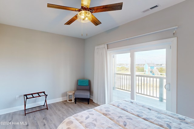 bedroom featuring light wood-type flooring, access to outside, and ceiling fan