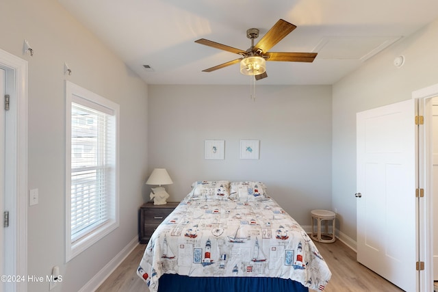 bedroom featuring light hardwood / wood-style flooring and ceiling fan