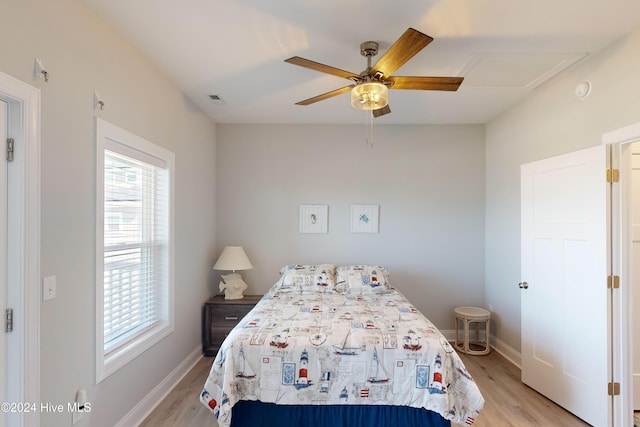1796 New River Inlet Rd, North Topsail Beach, NC 28460 - bedroom with multiple windows, light wood-style flooring, and baseboards