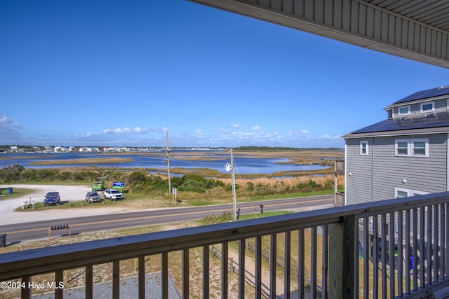 balcony featuring a water view