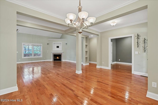 unfurnished living room with ornamental molding, light wood-type flooring, beam ceiling, and an inviting chandelier