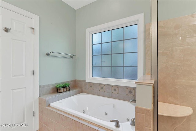 bathroom with separate shower and tub