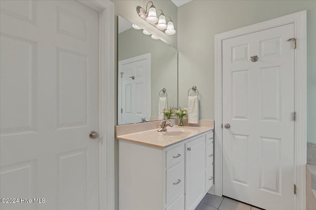 bathroom with vanity and tile patterned flooring