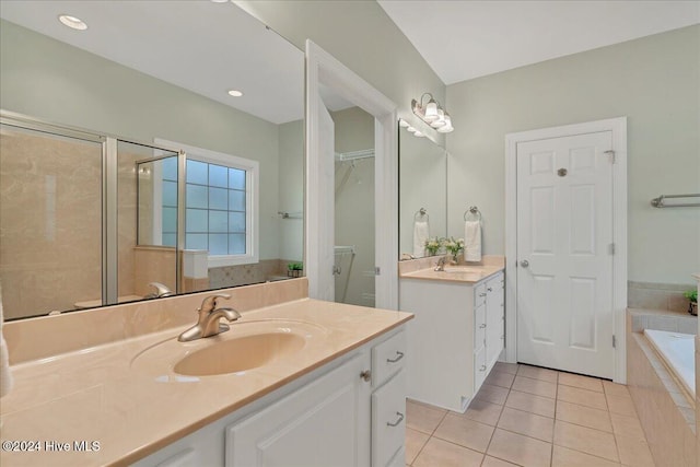 bathroom with independent shower and bath, vanity, and tile patterned flooring