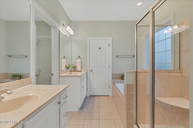 bathroom with vanity, plus walk in shower, and tile patterned flooring