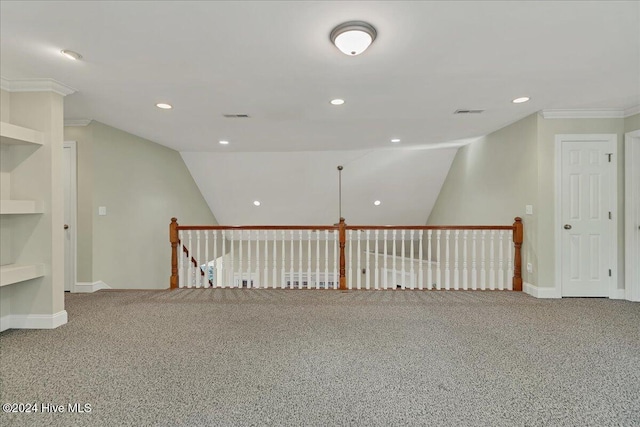 unfurnished room with carpet, vaulted ceiling, and ornamental molding