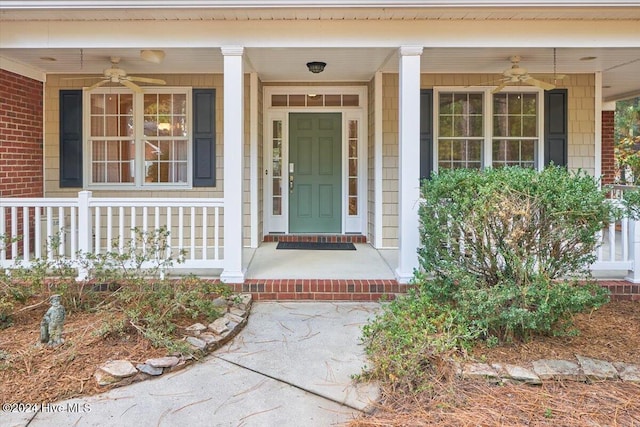 doorway to property with covered porch and ceiling fan