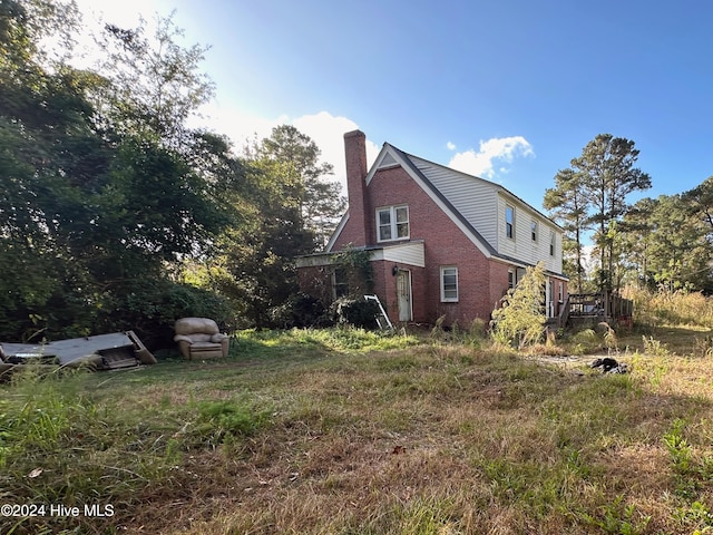 view of home's exterior with a deck