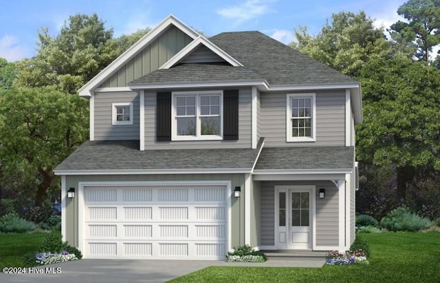 view of front of home with a garage and a front yard