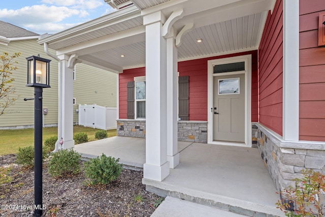 entrance to property featuring a porch