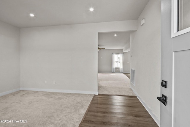 spare room featuring ceiling fan and dark hardwood / wood-style floors