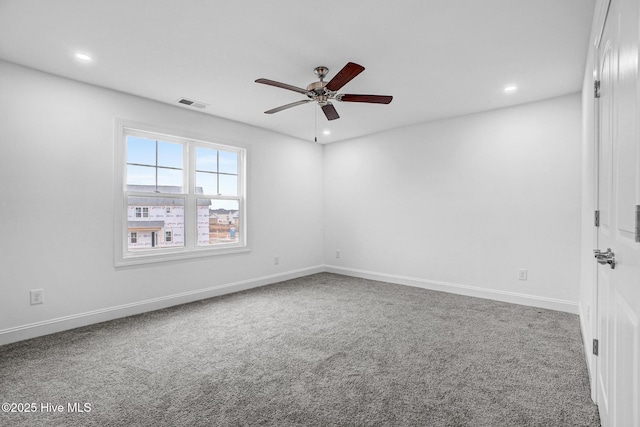 carpeted empty room featuring ceiling fan