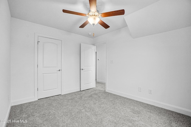 unfurnished bedroom featuring light colored carpet and ceiling fan