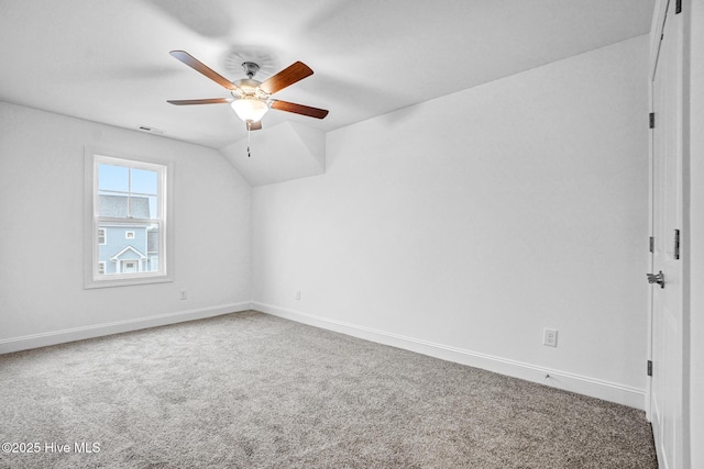 additional living space with carpet, lofted ceiling, and ceiling fan