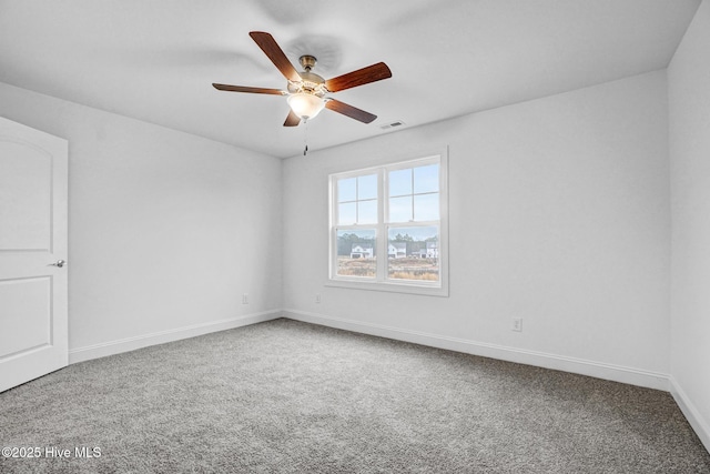 carpeted empty room featuring ceiling fan