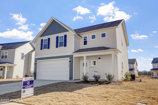 front of property with a garage