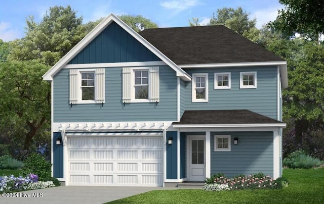 view of front facade featuring a garage and a front yard