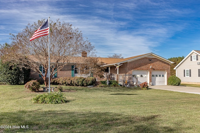 view of front of home with a garage and a front yard