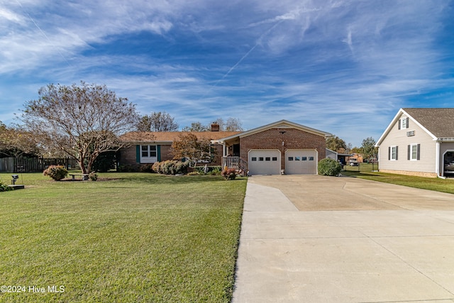 single story home with a garage and a front yard