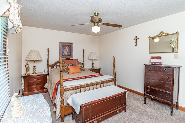 103 Shamrock Rd, Goldsboro, NC 27530 - bedroom featuring carpet, a textured ceiling, a ceiling fan, and baseboards