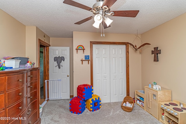 103 Shamrock Rd, Goldsboro, NC 27530 - rec room featuring carpet, a textured ceiling, and ceiling fan