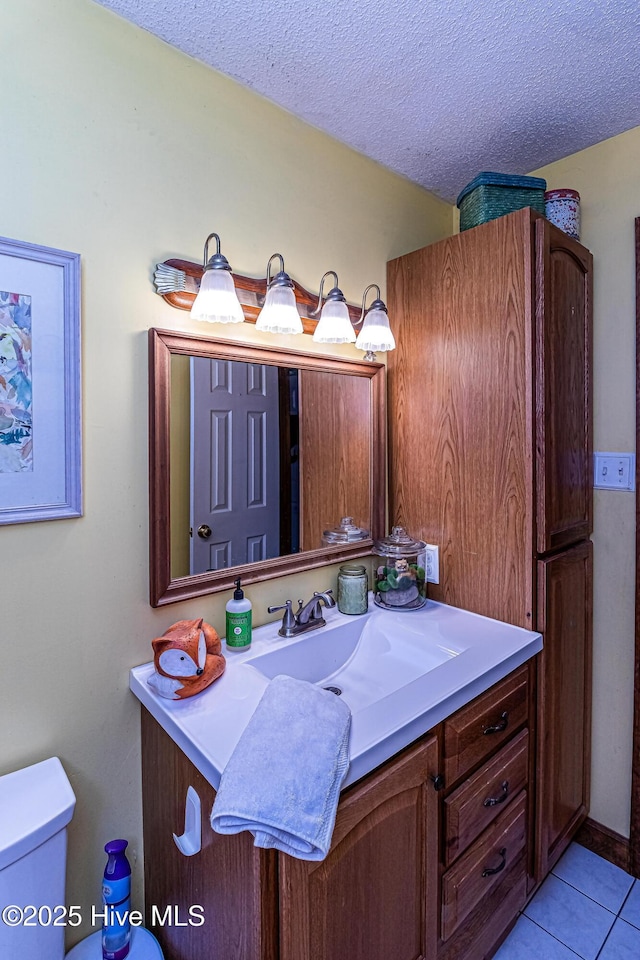 103 Shamrock Rd, Goldsboro, NC 27530 - bathroom featuring toilet, tile patterned floors, vanity, and a textured ceiling