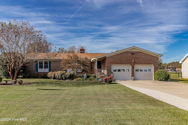 ranch-style home with a garage and a front yard