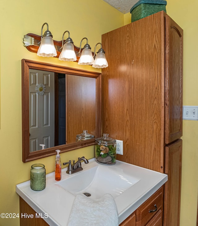 bathroom featuring vanity and a textured ceiling