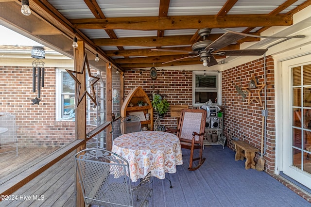 wooden deck featuring ceiling fan