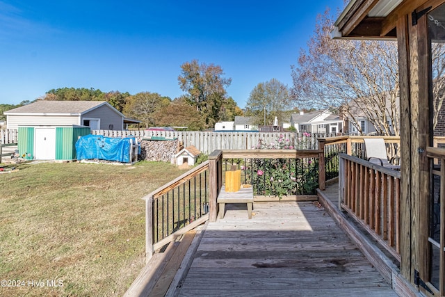 deck with a shed and a yard