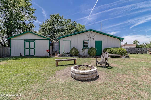 103 Shamrock Rd, Goldsboro, NC 27530 - back of property featuring a fire pit and an outbuilding