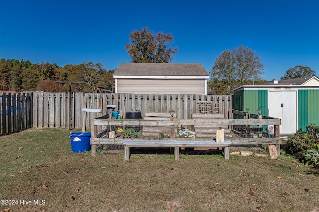 exterior space featuring an outbuilding and a lawn