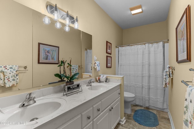 bathroom with vanity, toilet, and walk in shower