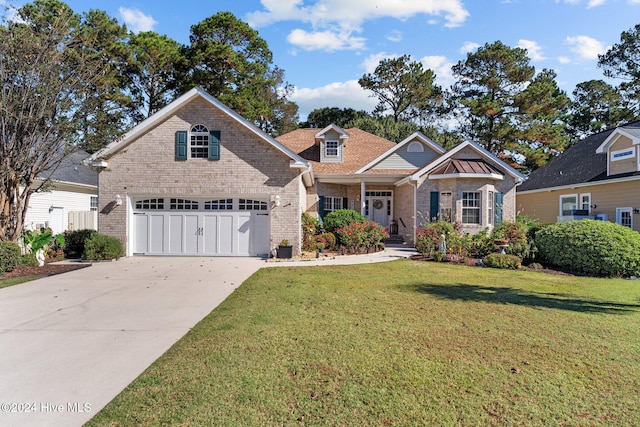 view of front of home with a garage and a front yard