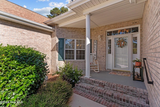 property entrance featuring a porch