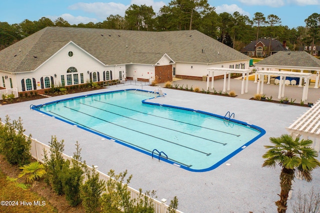 view of swimming pool featuring a patio area