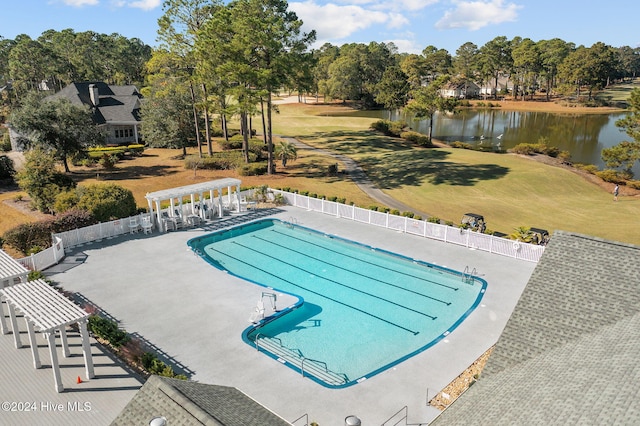 view of swimming pool with a water view and a patio