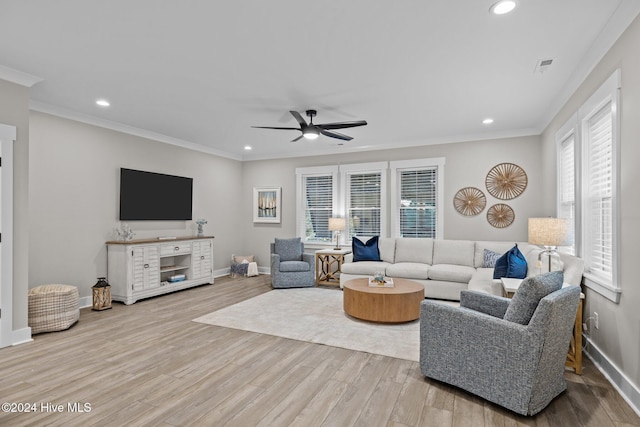 living room featuring ceiling fan, light hardwood / wood-style floors, and ornamental molding