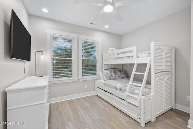 bedroom featuring light hardwood / wood-style flooring and ceiling fan