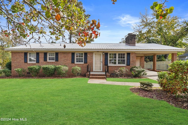 single story home featuring a front yard and a carport