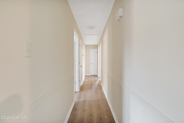 corridor featuring light hardwood / wood-style floors