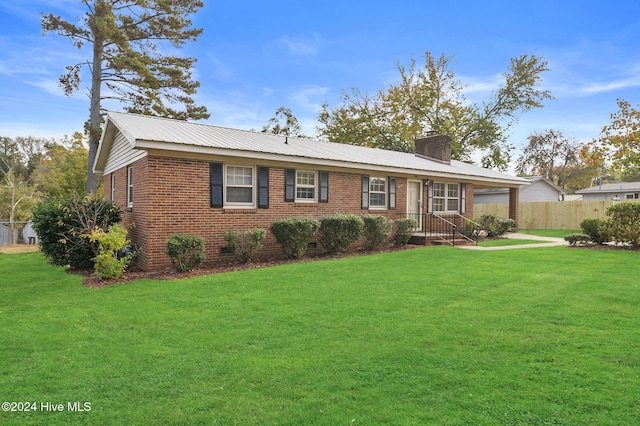 ranch-style home with a front lawn