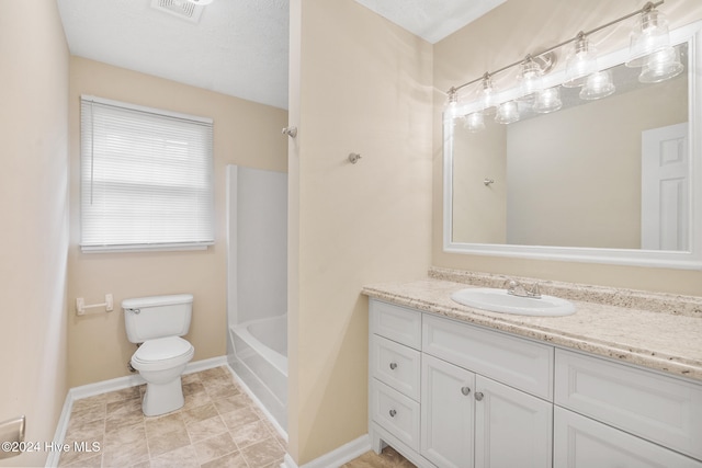 full bathroom with vanity, a textured ceiling, toilet, and shower / bathtub combination