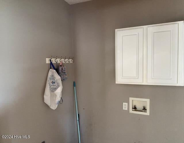 laundry area featuring cabinets and washer hookup